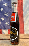 Véritable Bouteille en Verre Coca-Cola - Iowa Hawkeyes - 1985 - Pleine et Scellée - Provenance États-Unis